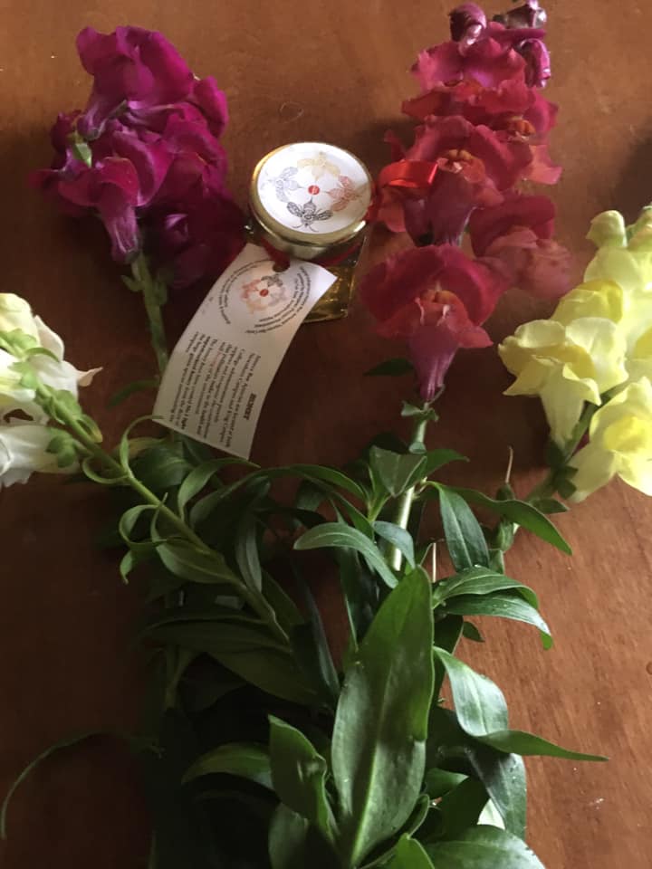 snapdragons and local honey on table